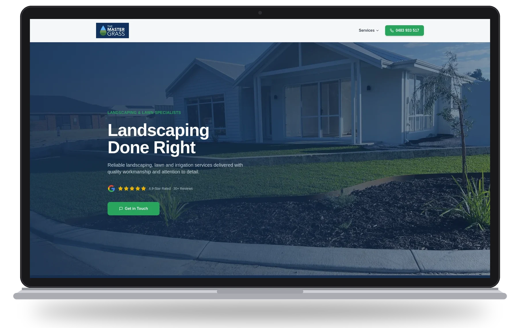 The Master Grass website shown on a laptop